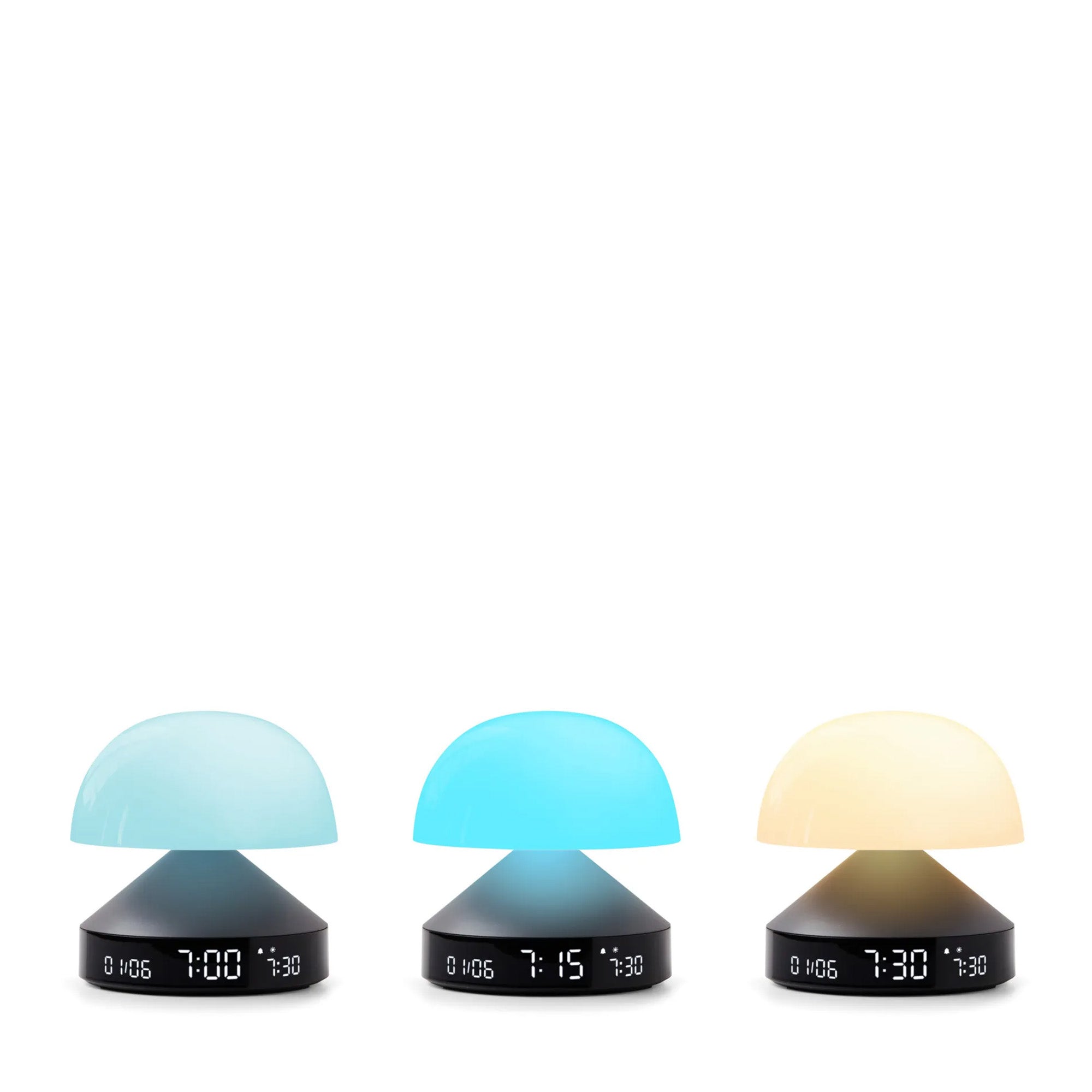 Three mushroom-shaped alarm clocks with different colored tops
